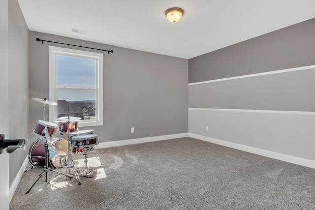 rec room featuring carpet floors, baseboards, and visible vents