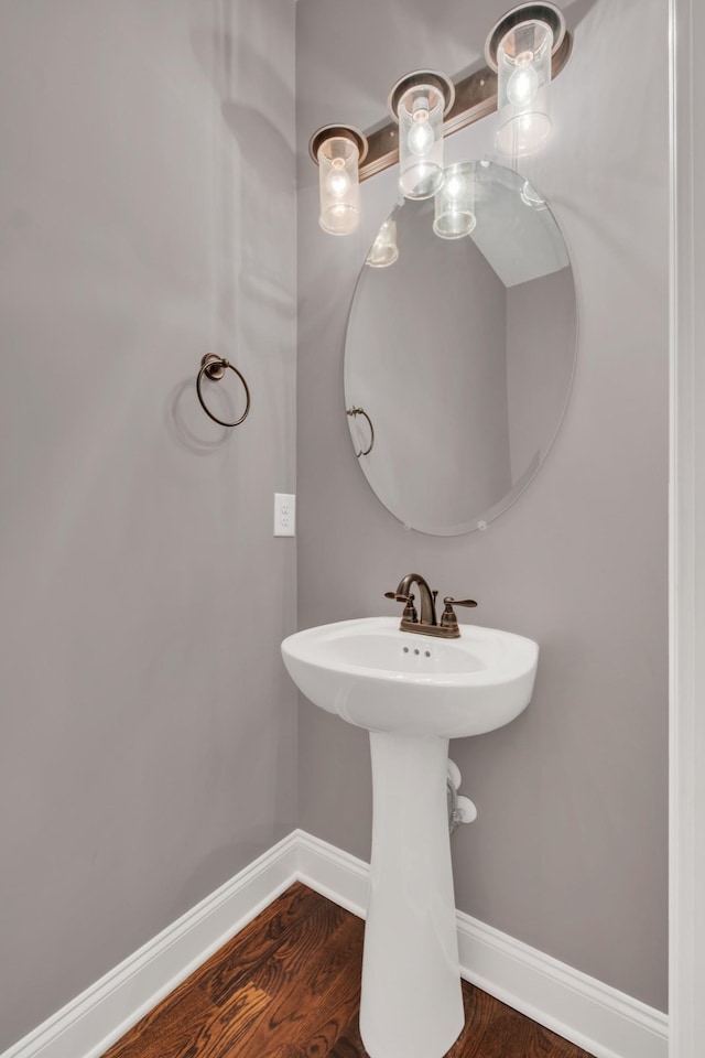 bathroom featuring baseboards and wood finished floors