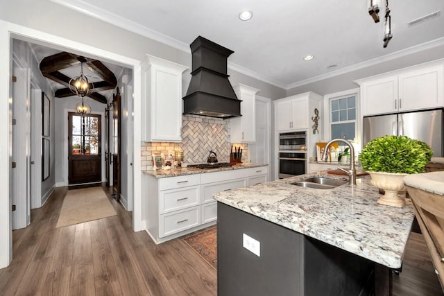 kitchen featuring white cabinets, sink, dark hardwood / wood-style floors, and custom exhaust hood