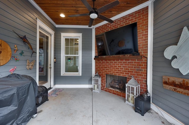 exterior space featuring an outdoor brick fireplace, ceiling fan, and a grill