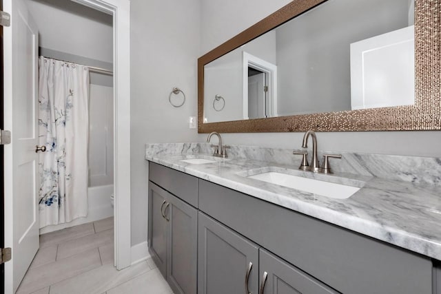 full bathroom featuring vanity, shower / tub combo, and toilet