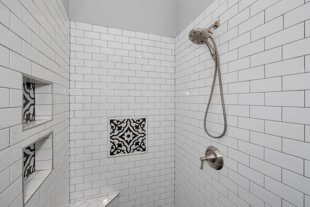 bathroom featuring tiled shower