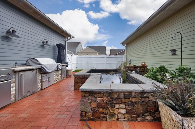 view of patio / terrace featuring a grill