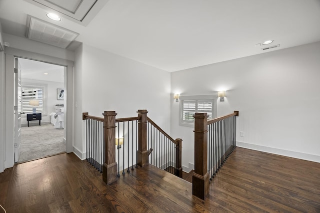 stairs with hardwood / wood-style floors