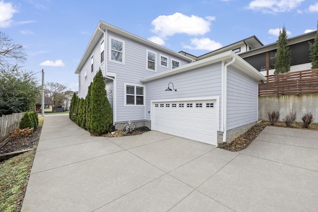 view of side of home featuring a garage