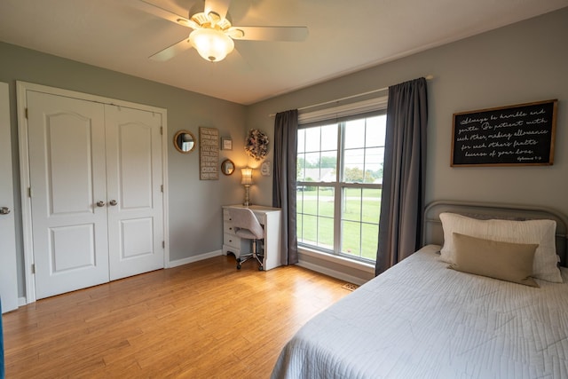 bedroom featuring a closet, ceiling fan, and light hardwood / wood-style flooring