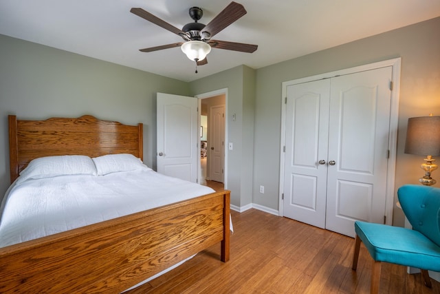 bedroom with ceiling fan, a closet, and light wood-type flooring