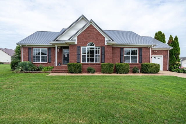 view of front of house featuring a garage and a front lawn