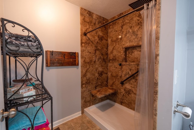 bathroom with tile patterned flooring, a textured ceiling, and a shower with shower curtain