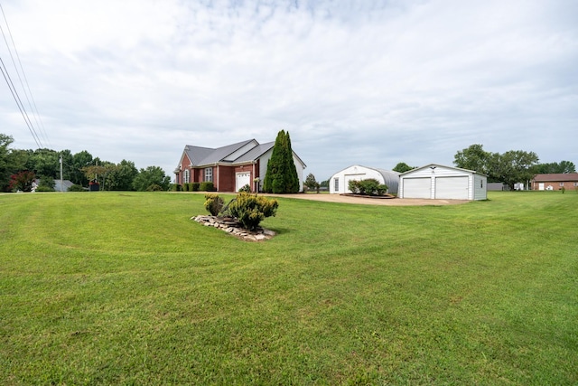 view of yard with a garage