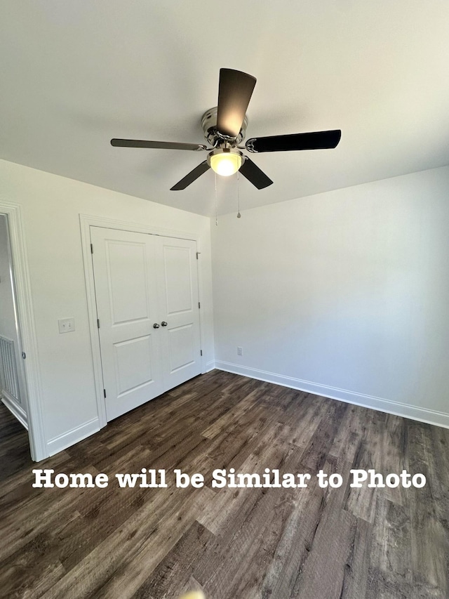 unfurnished bedroom with dark hardwood / wood-style flooring, a closet, and ceiling fan