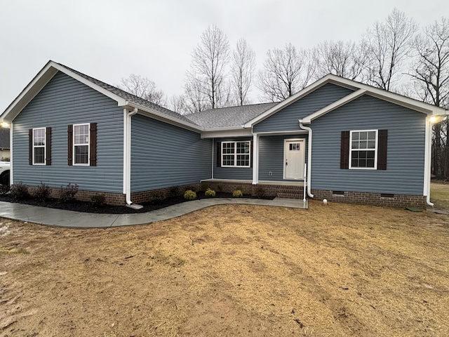 single story home featuring a front lawn