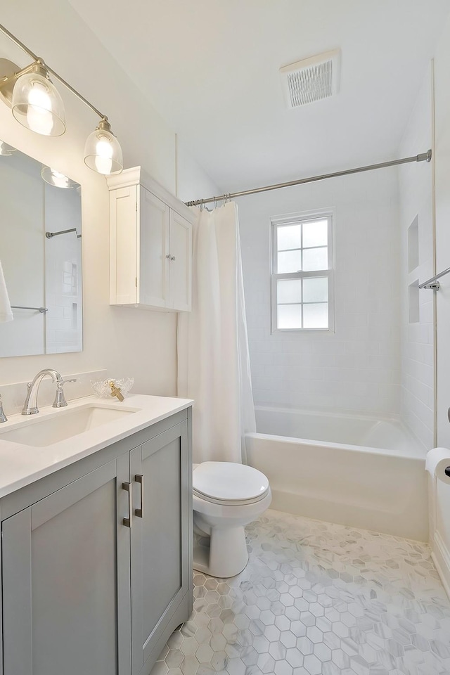 full bathroom with toilet, vanity, shower / tub combo with curtain, and tile patterned flooring