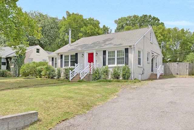 view of front of home with a front lawn