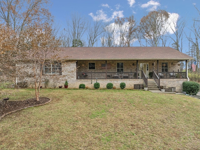 ranch-style house featuring a porch, a front yard, and central AC