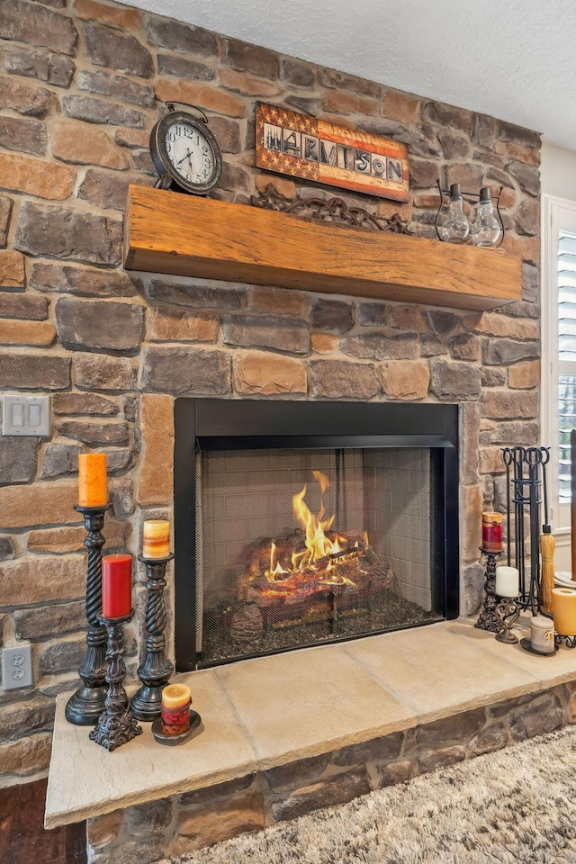 room details with a fireplace and a textured ceiling