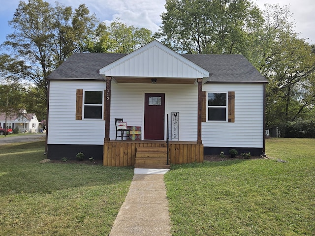 bungalow-style home with a front yard