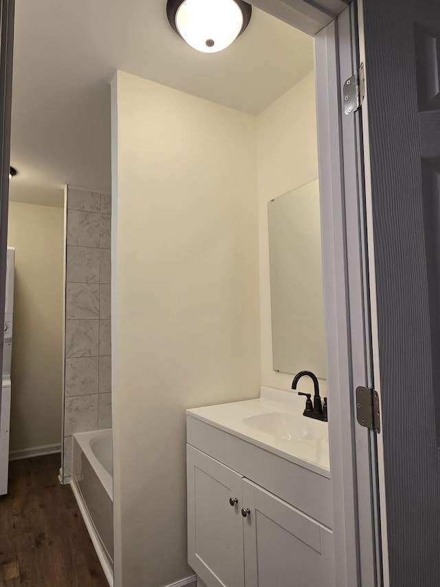 bathroom featuring vanity and hardwood / wood-style flooring