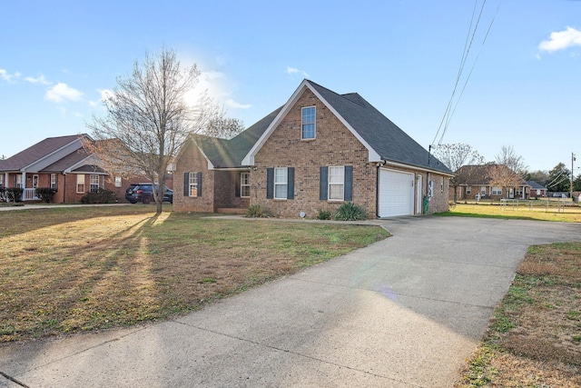 view of front facade with a front yard and a garage