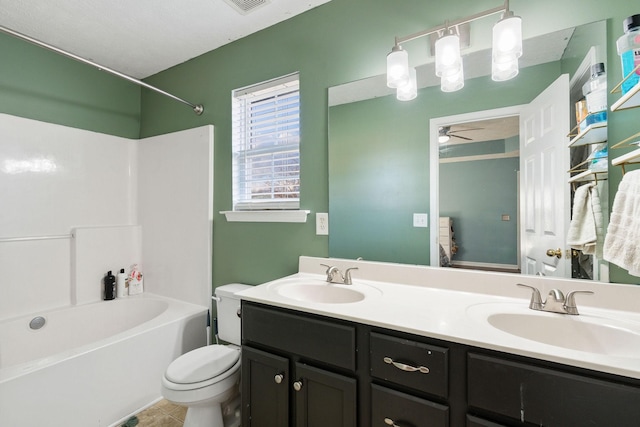 full bathroom with tub / shower combination, vanity, ceiling fan, tile patterned flooring, and toilet