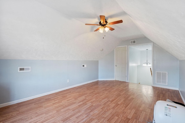 bonus room featuring ceiling fan, light hardwood / wood-style flooring, and lofted ceiling