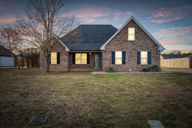 view of front of property with a yard