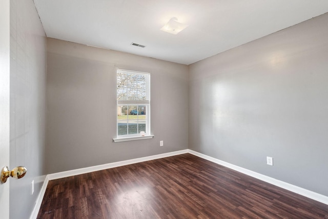 empty room featuring dark hardwood / wood-style floors