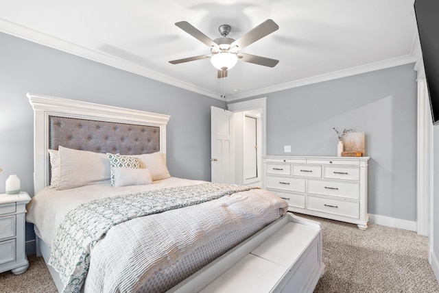 carpeted bedroom featuring ceiling fan and crown molding