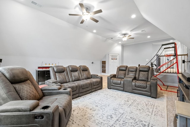 carpeted living room with ceiling fan and lofted ceiling