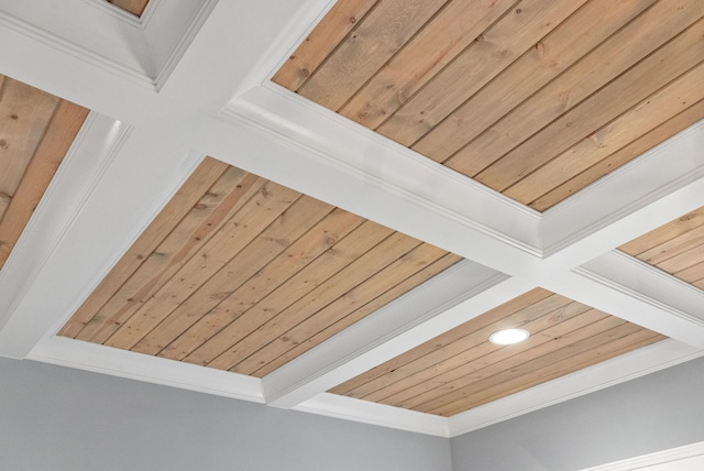 interior details with beamed ceiling, wood ceiling, and ornamental molding