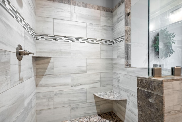 bathroom featuring tiled shower