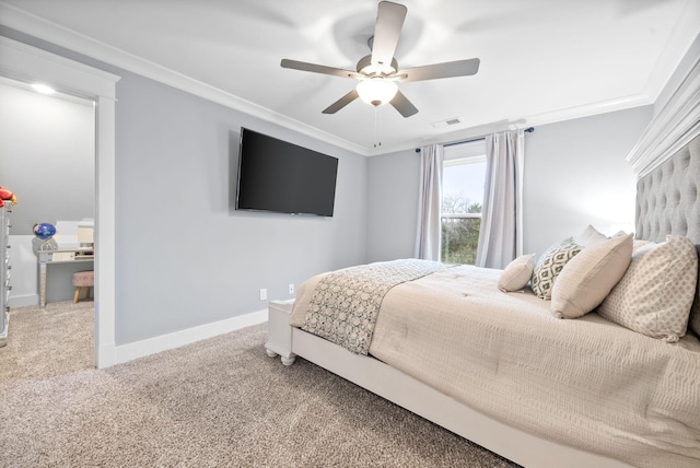 carpeted bedroom featuring ceiling fan and crown molding