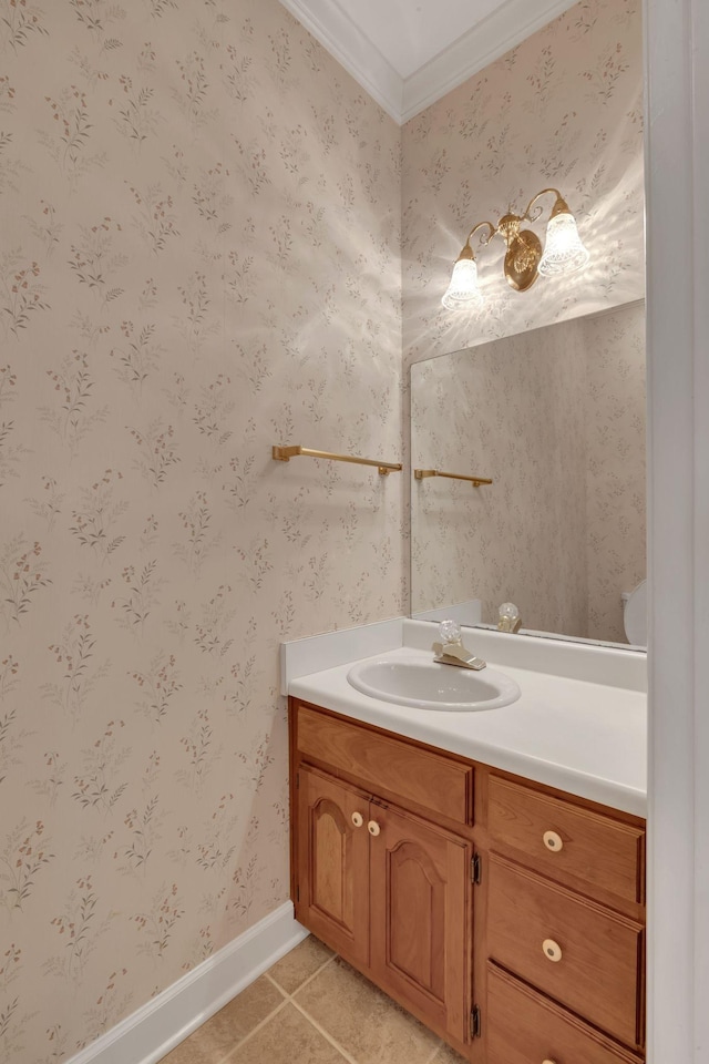 bathroom featuring tile patterned floors, crown molding, and vanity