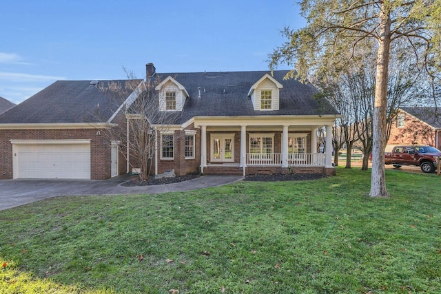 cape cod-style house featuring a front lawn, a porch, and a garage