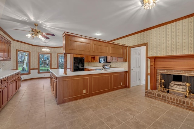 kitchen with kitchen peninsula, crown molding, a fireplace, light tile patterned flooring, and black appliances