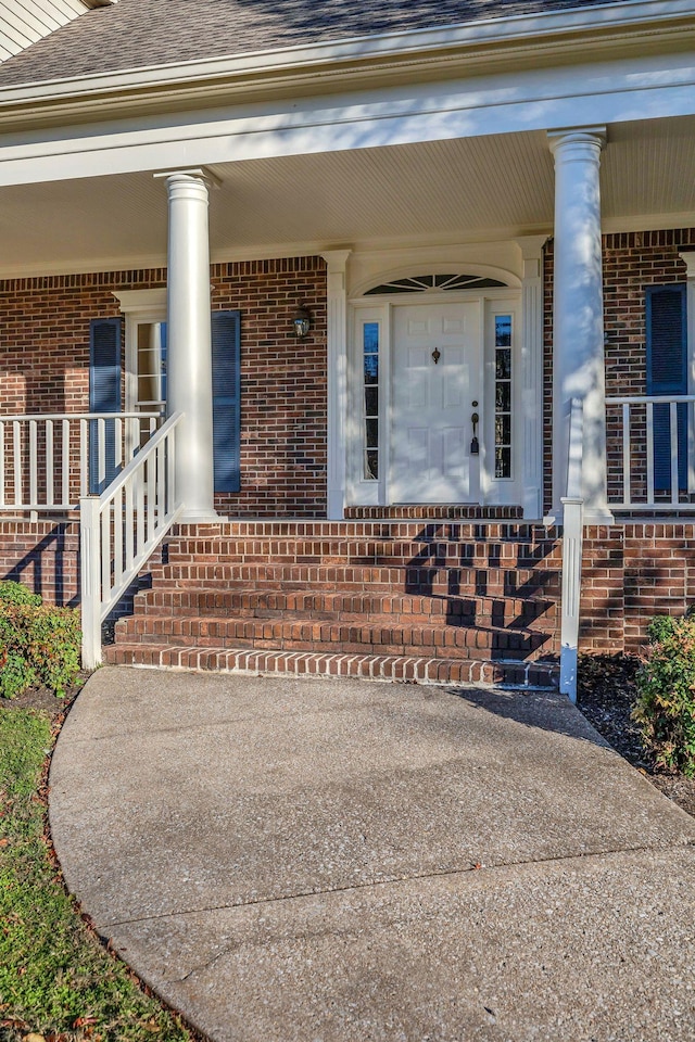 doorway to property with covered porch