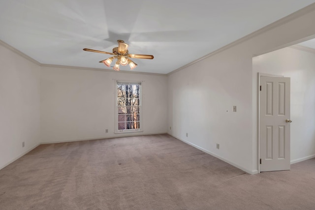 unfurnished room with ceiling fan, light colored carpet, and ornamental molding