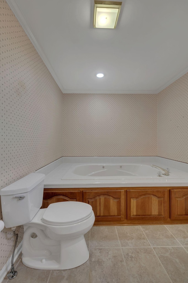 bathroom with tile patterned flooring, toilet, crown molding, and a tub