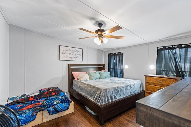 bedroom with ceiling fan and dark hardwood / wood-style flooring