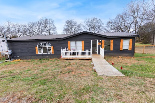 ranch-style house with a front lawn