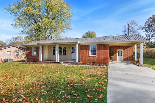 ranch-style house featuring a porch, a carport, a front lawn, and central air condition unit