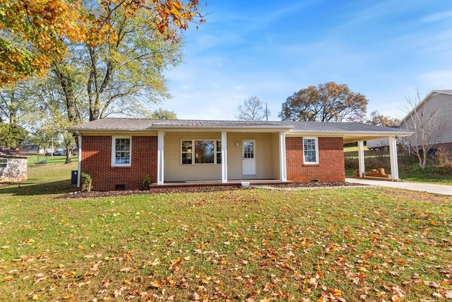 ranch-style home featuring a front lawn, covered porch, and a carport