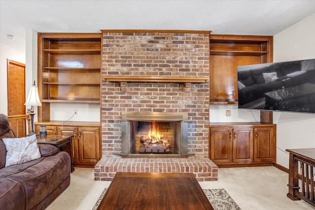 carpeted living room featuring a fireplace and a textured ceiling