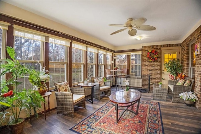 sunroom / solarium featuring ceiling fan