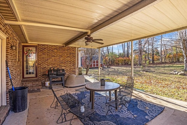 view of patio featuring area for grilling and ceiling fan