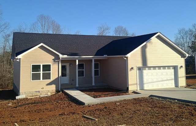 ranch-style house with a garage and covered porch