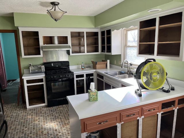 kitchen featuring a textured ceiling, sink, and black gas range oven