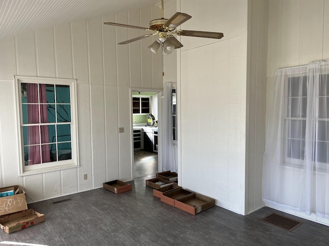 exterior space with vaulted ceiling and ceiling fan