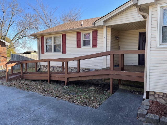 property entrance featuring a deck