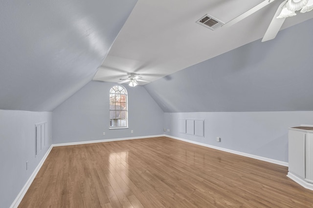 additional living space featuring ceiling fan, hardwood / wood-style floors, and vaulted ceiling